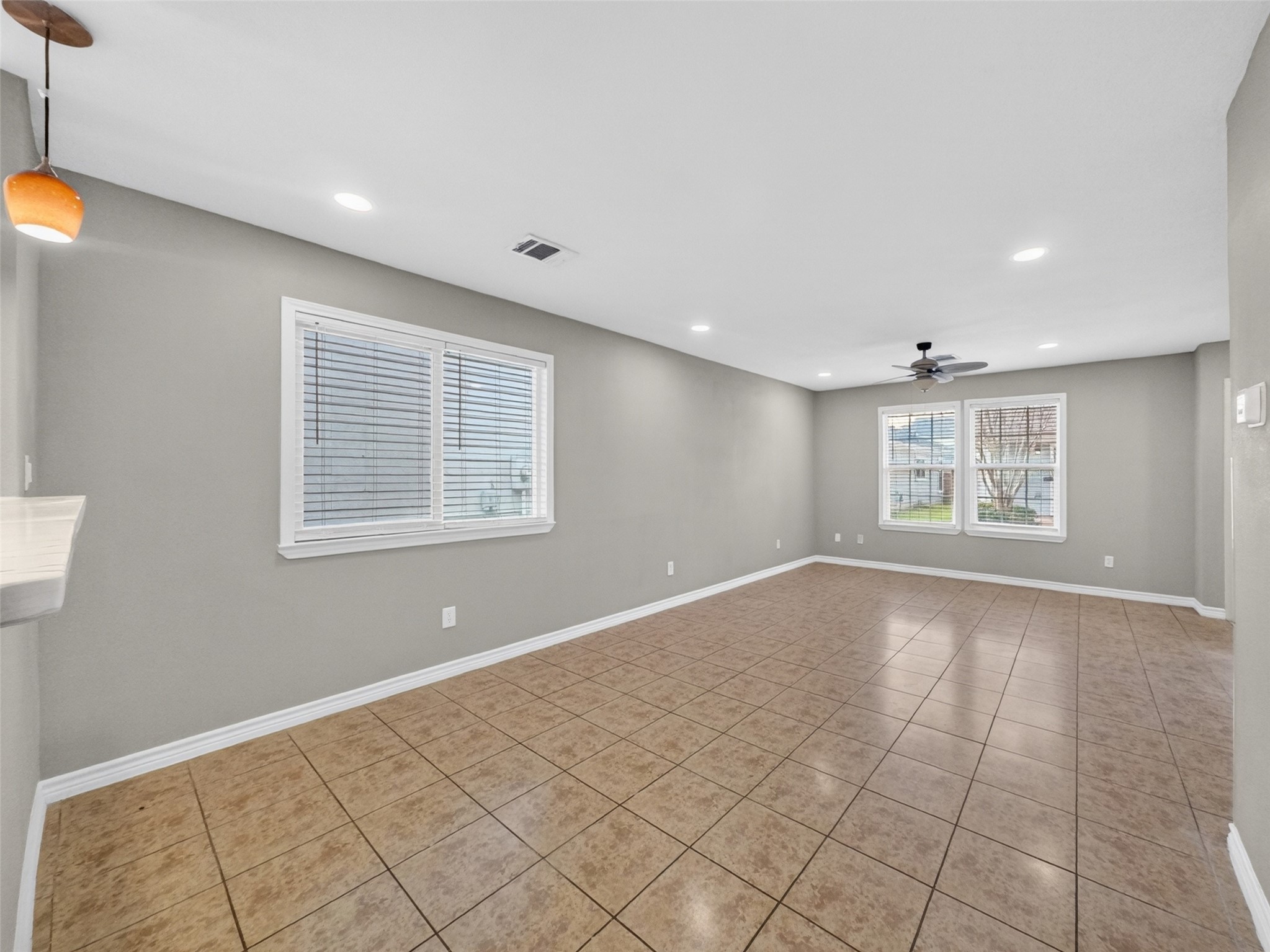 6231 Lone Prairie Way Katy, TX 77449 - Photo 7 of 27 Kick off your shoes and sprawl out—this spacious living room easily handles movie nights, dance parties, or your favorite sectional. It’s the heart of the home with room for everyone.