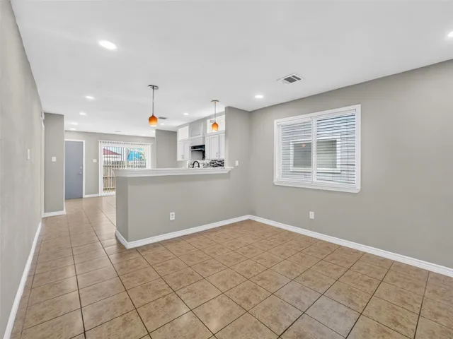 a view of kitchen with window and wooden floor