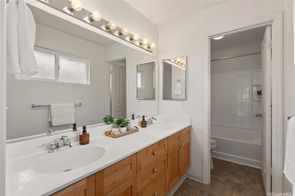 a bathroom with a sink double vanity and a mirror
