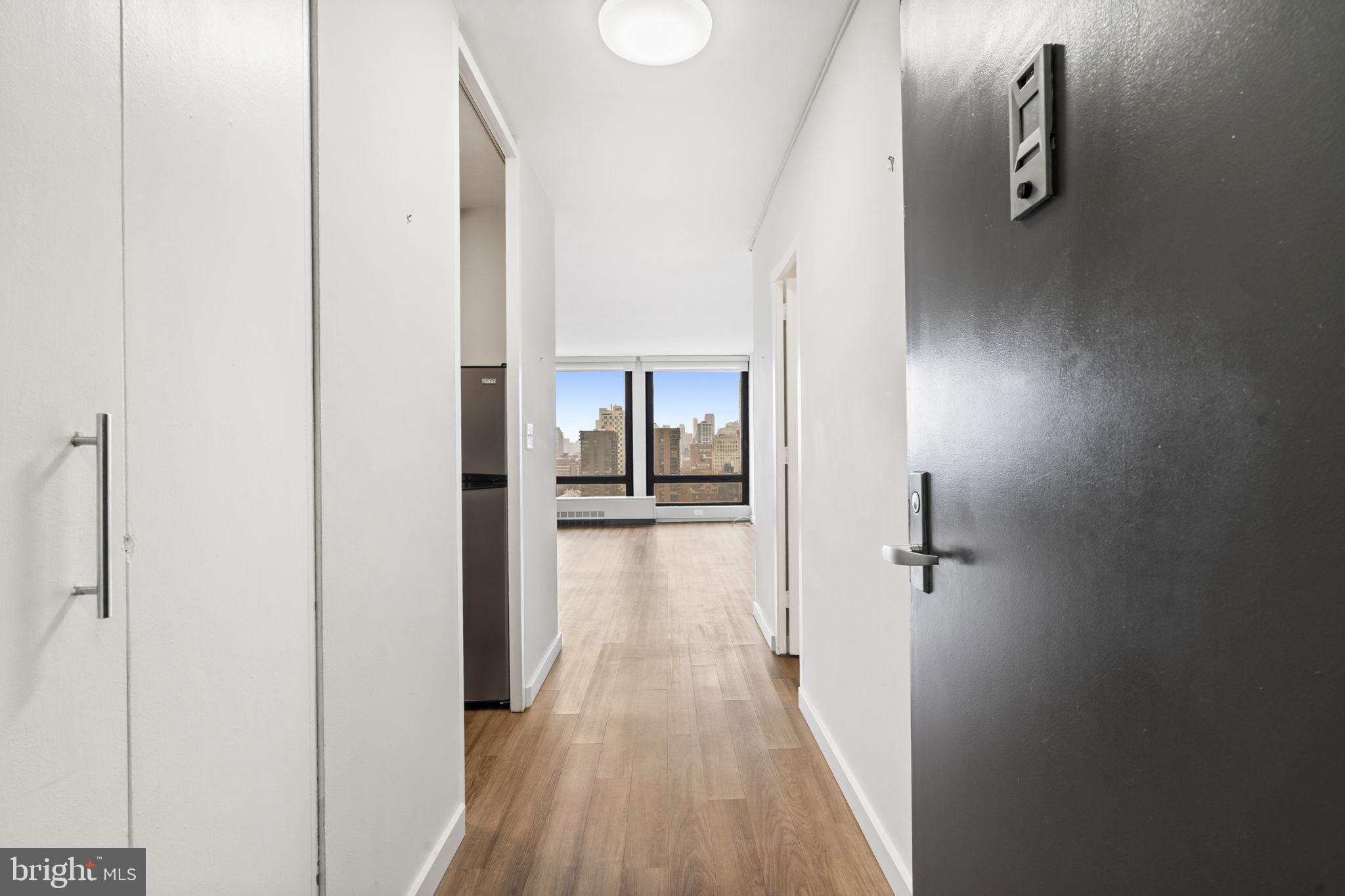 210 Locust Street, Unit 21E Philadelphia, PA 19106 - Photo 14 of 36 a view of a room with wooden floor