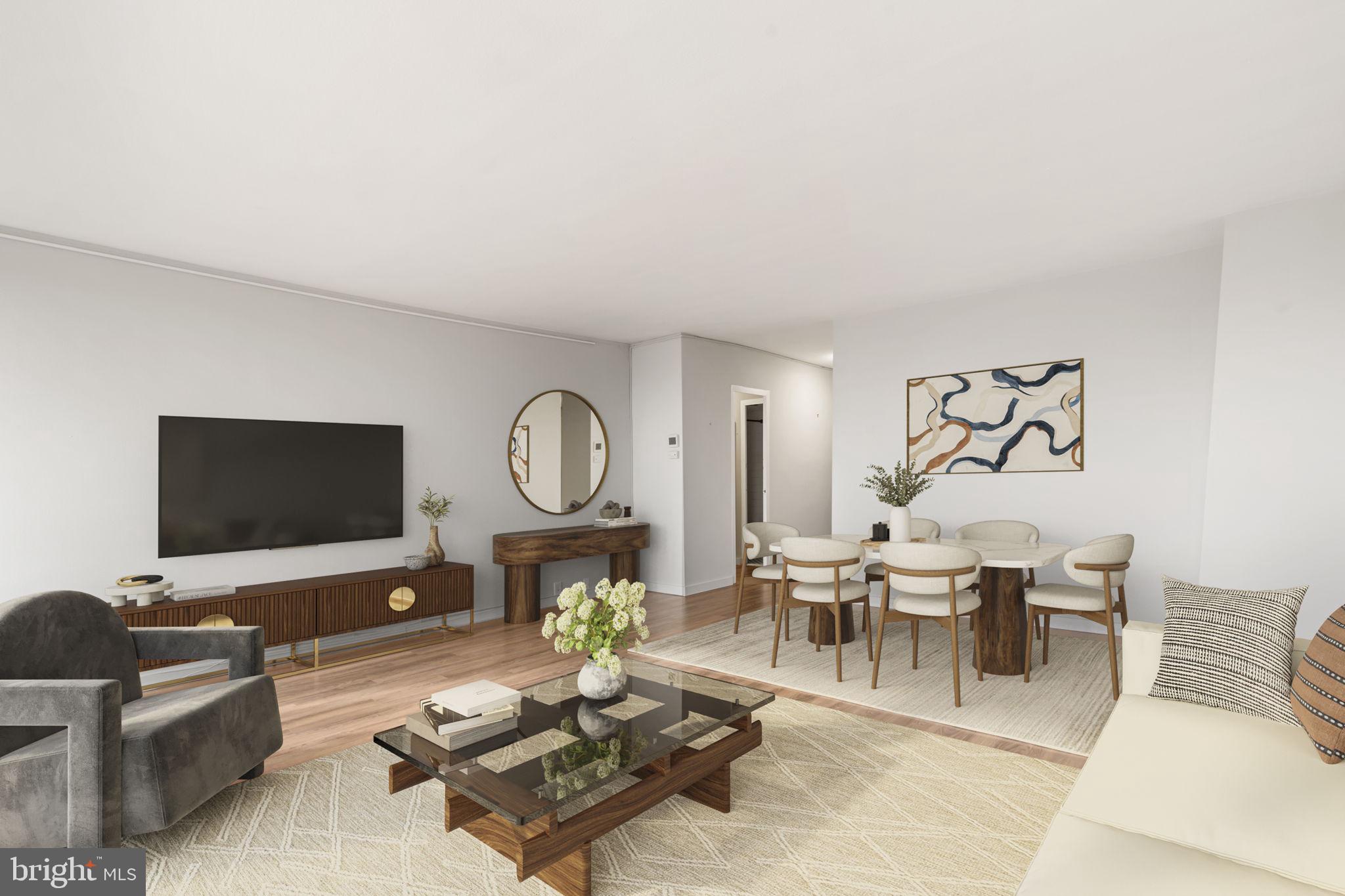 210 Locust Street, Unit 21E Philadelphia, PA 19106 - Photo 20 of 36 a living room with furniture a flat screen tv and a large window