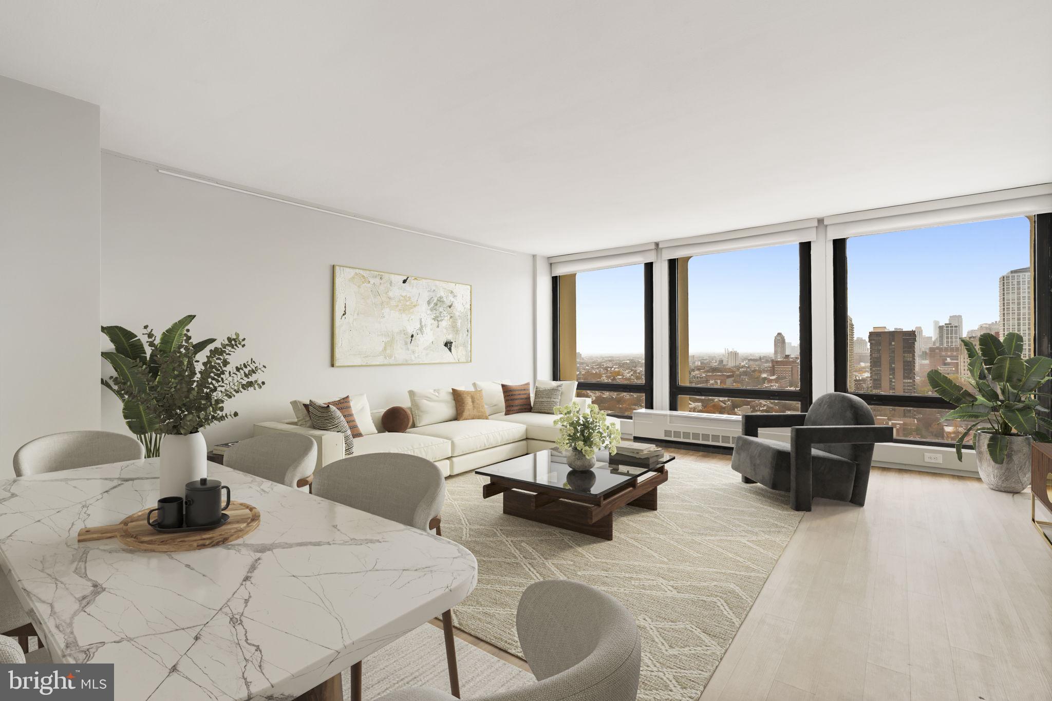 210 Locust Street, Unit 21E Philadelphia, PA 19106 - Photo 25 of 36 a living room with furniture and large windows