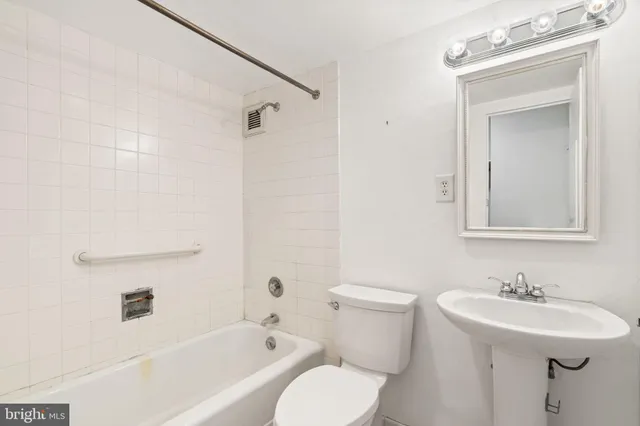 a kitchen with stainless steel appliances granite countertop a sink and a stove