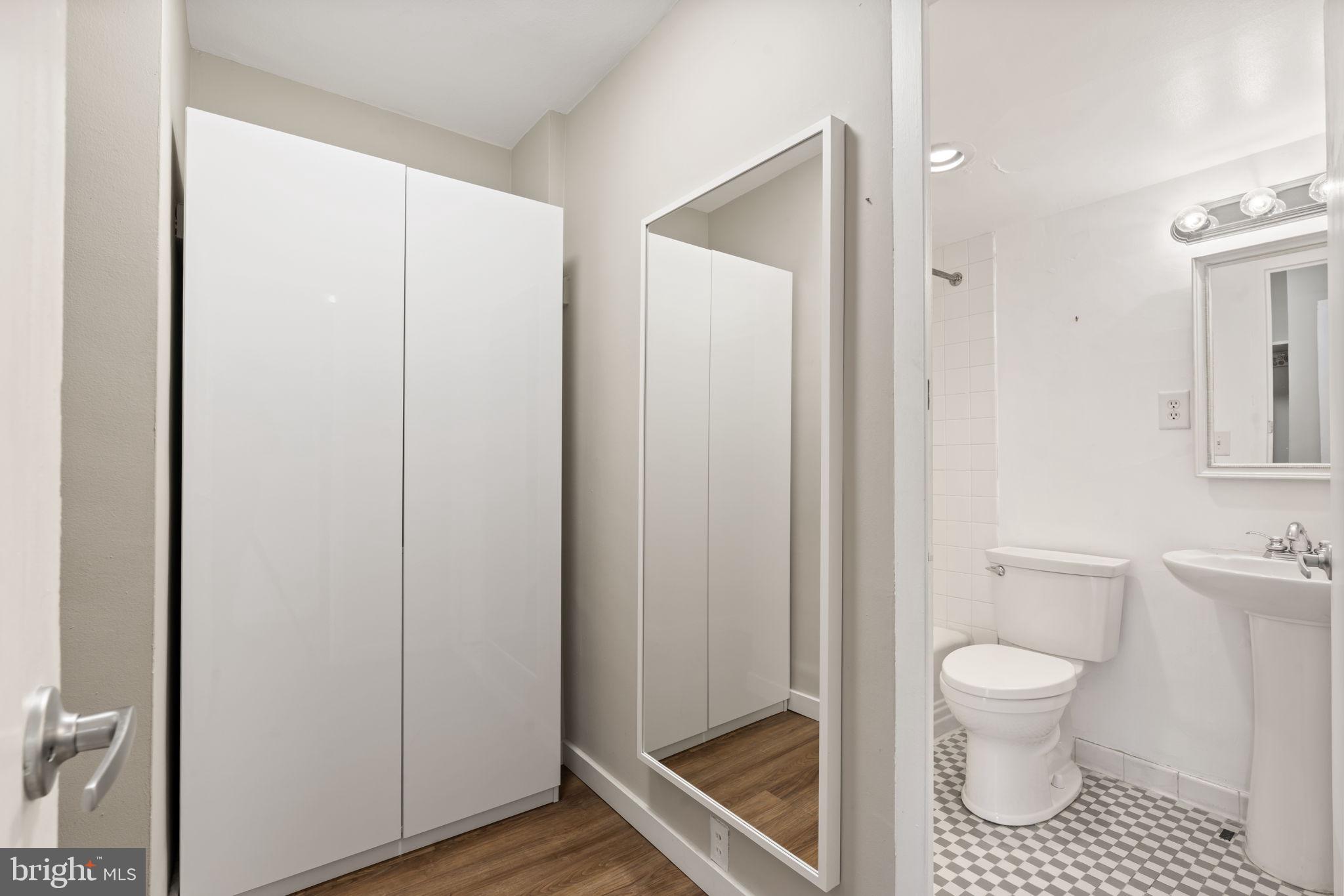 210 Locust Street, Unit 21E Philadelphia, PA 19106 - Photo 29 of 36 a bathroom with a toilet and a shower