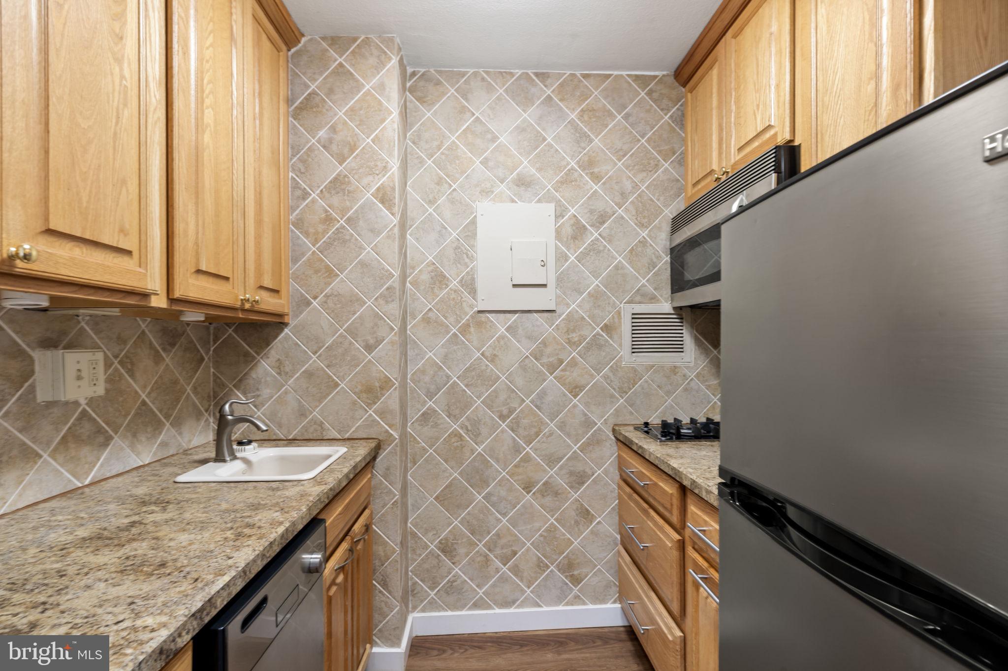 210 Locust Street, Unit 21E Philadelphia, PA 19106 - Photo 33 of 36 a bathroom with a granite countertop sink and a granite