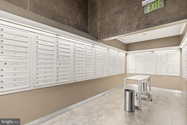 a lobby with furniture and a chandelier