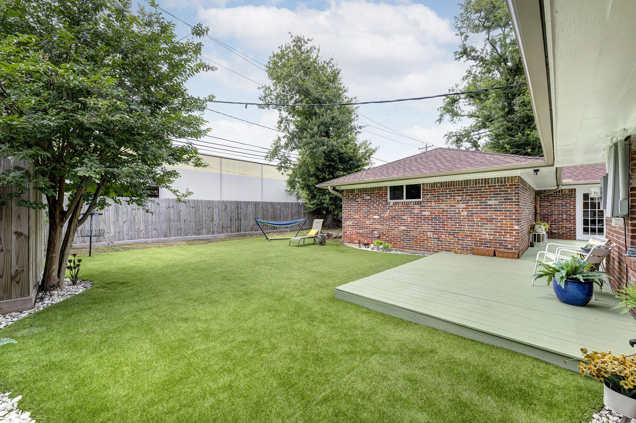 1111 Clovis Road Houston, TX 77008 - Photo 24 of 32 The turfed area of the yard provides an area for year-round recreation and effortless upkeep.