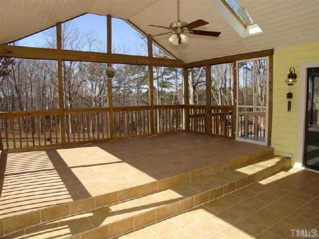Screened in porch with tile flooring