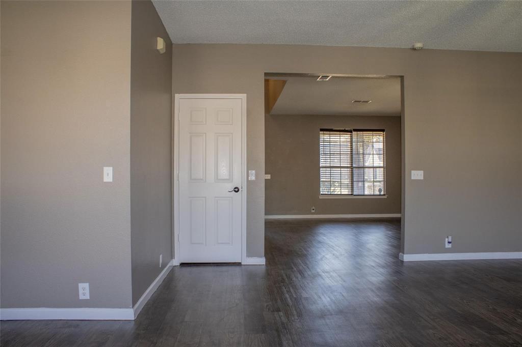 3240 Roddy Drive Fort Worth, TX 76123 - Photo 10 of 28 an empty room with wooden floor and windows