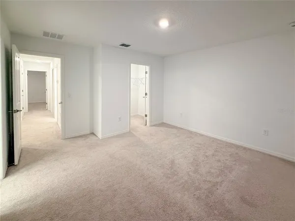 an empty room with a bathroom
