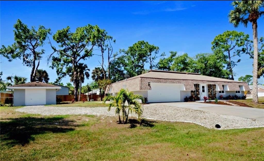 a house view with a garden space