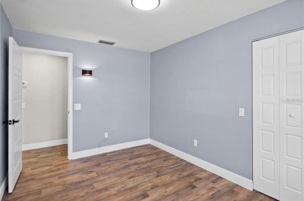2981 Crane Avenue North Port, FL 34286 - Photo 12 of 16 wooden floor in an empty room