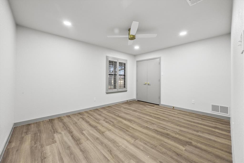 8 Harker Circle Rockwall, TX 75087 - Photo 15 of 29 an empty room with windows and ceiling fan