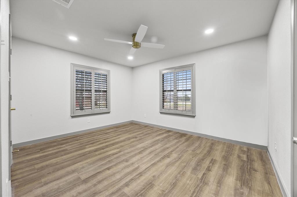 8 Harker Circle Rockwall, TX 75087 - Photo 16 of 29 wooden floor in an empty room with a window