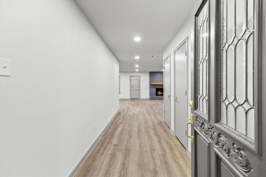 8 Harker Circle Rockwall, TX 75087 - Photo 4 of 29 a view of a hallway with wooden floor