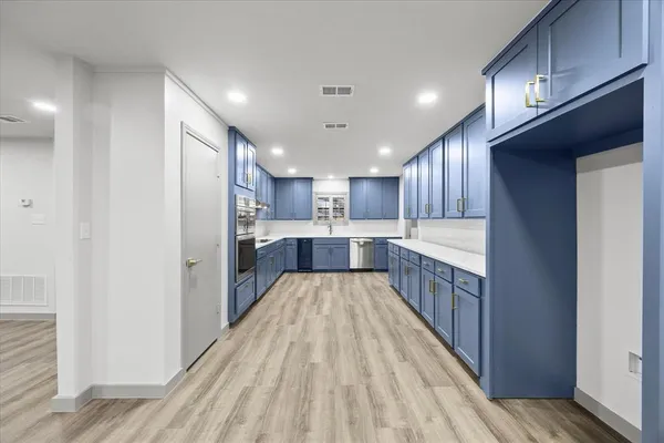 a view of kitchen with wooden floor