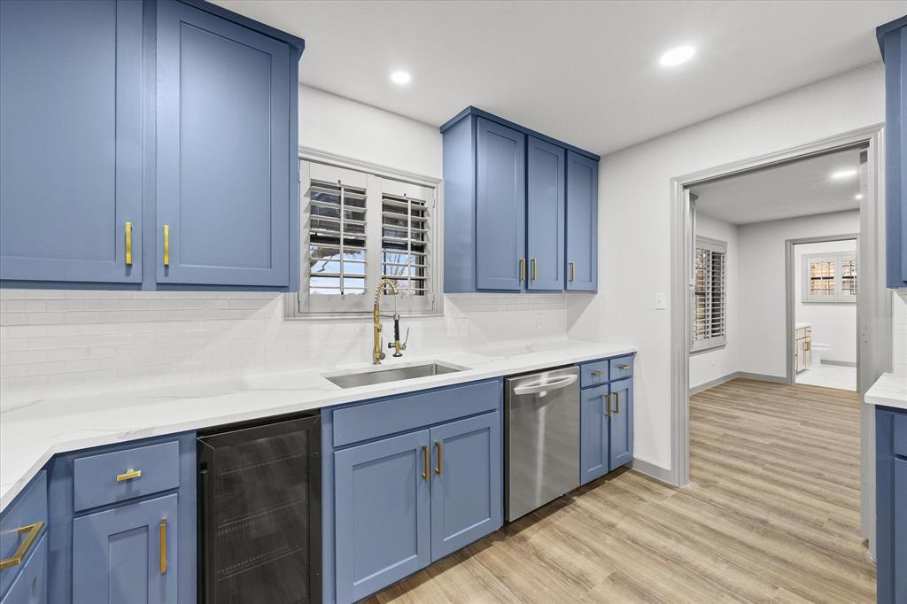 8 Harker Circle Rockwall, TX 75087 - Photo 10 of 29 a kitchen with a sink cabinets and wooden floor
