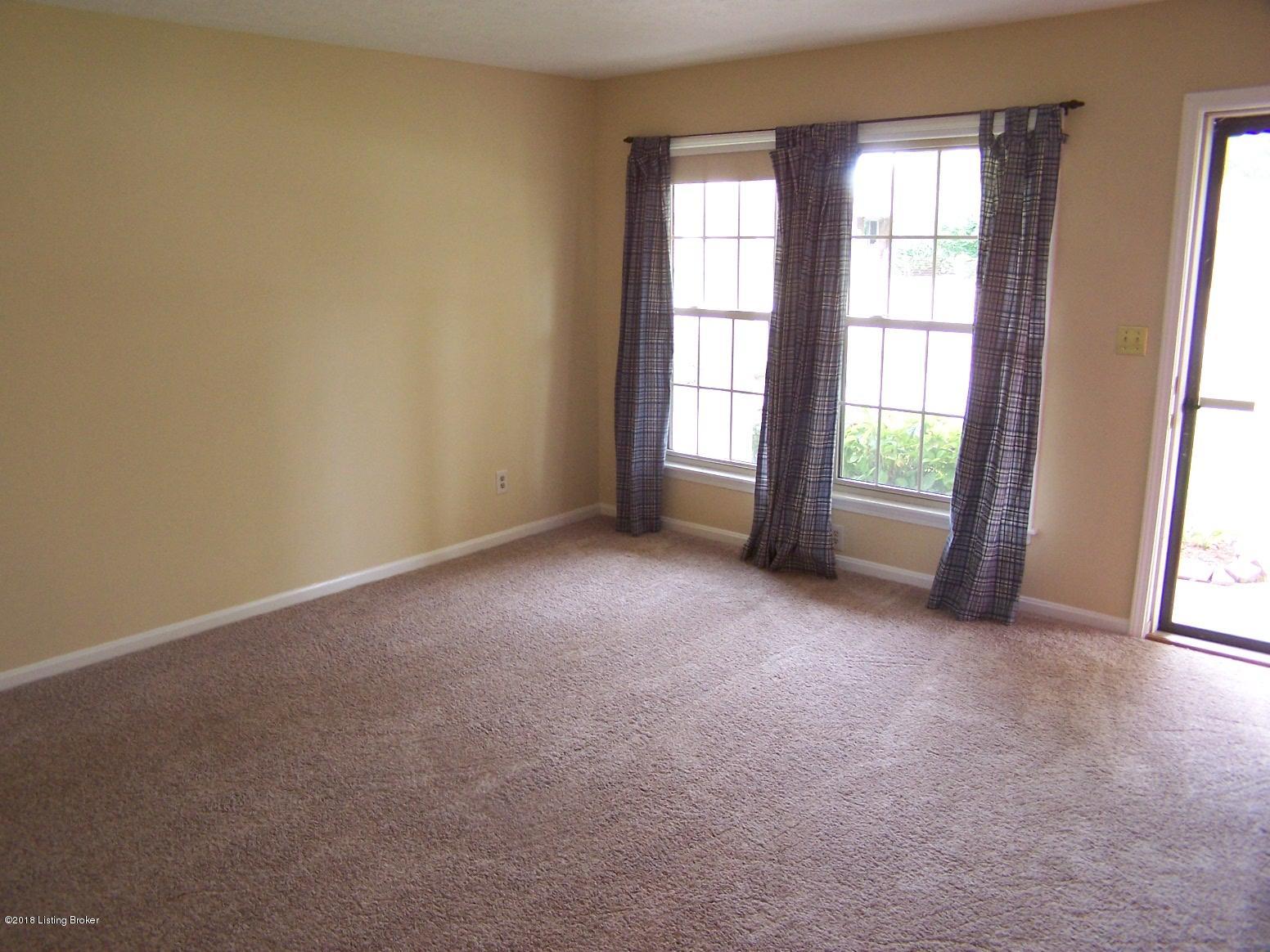 11004 Torrington Road Louisville, KY 40272 - Photo 30 of 43 Living Room with new carpeting, new paint, entry closet and room to entertain....