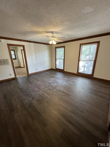 a view of an empty room with windows