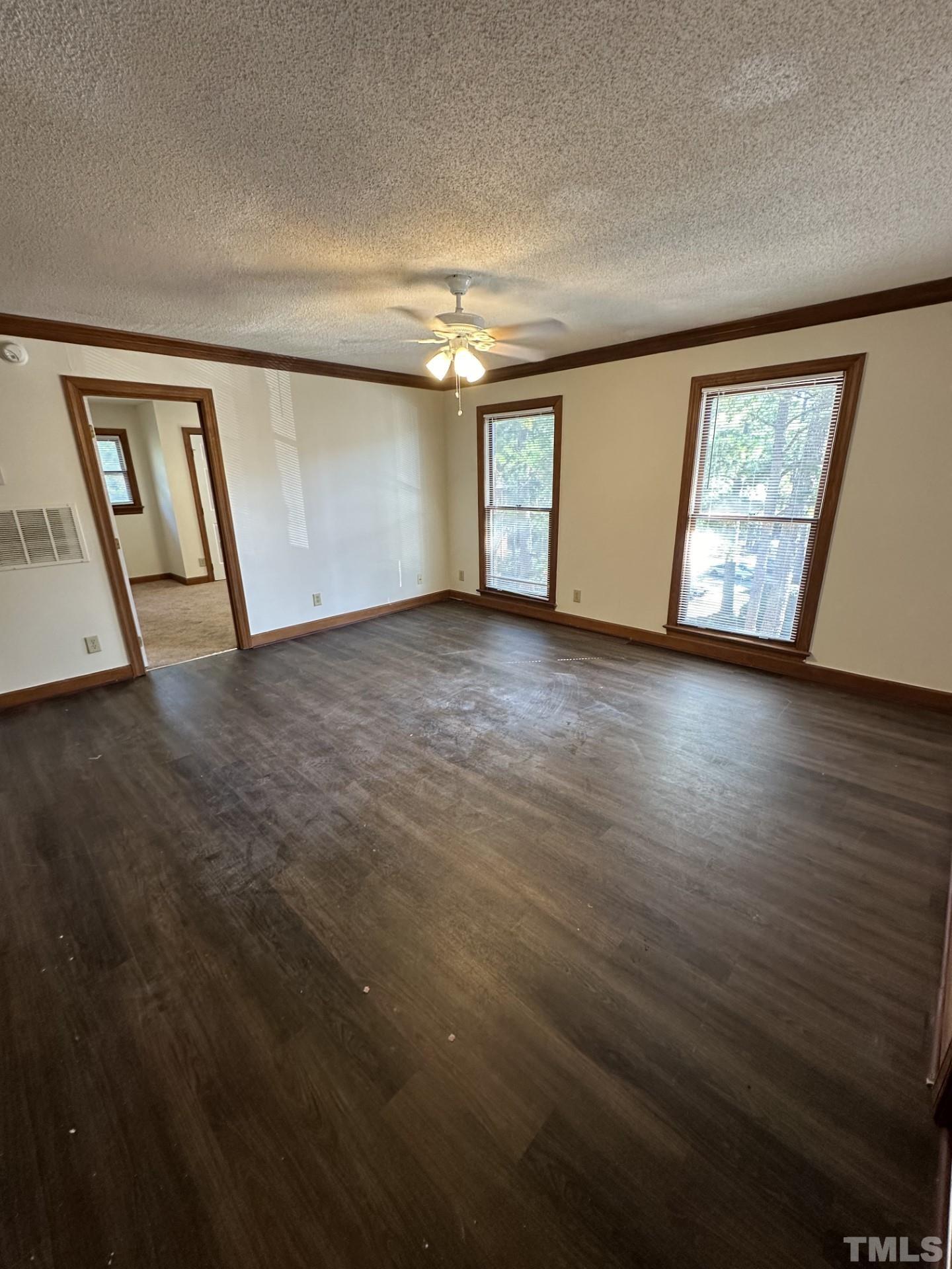 3531 Ivy Commons Drive, Unit 302 Raleigh, NC 27606 - Photo 2 of 4 a view of an empty room with windows
