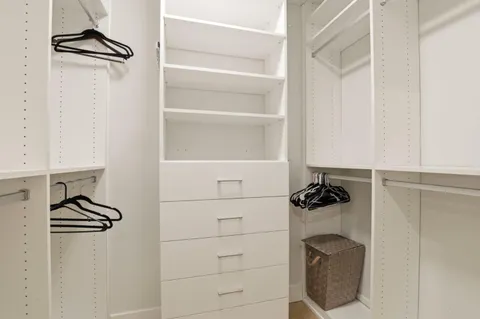 a bathroom with a double vanity sink and mirror