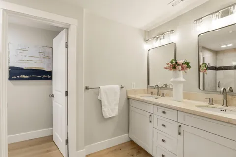 a bathroom with a shower and a glass door