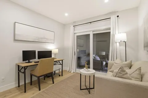 a view of a bedroom with washer and dryer