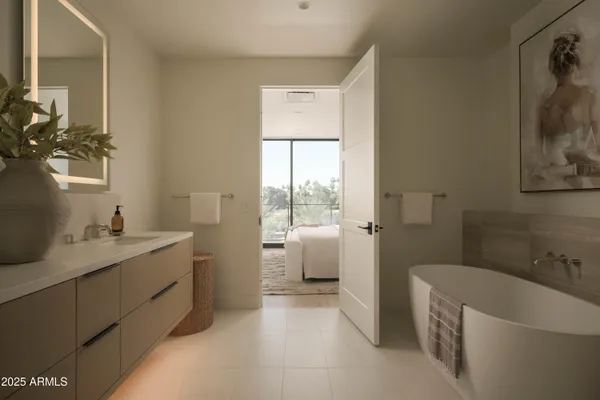 a bedroom with bed and a large window