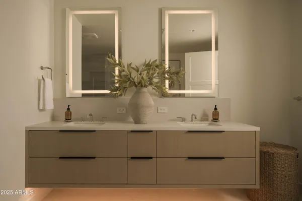 a bathroom with a granite countertop sink a toilet and shower