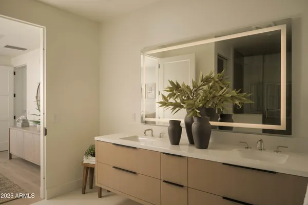 a bedroom with a bed a mirror and a large window