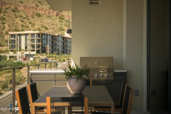 a view of a dining room with furniture and window