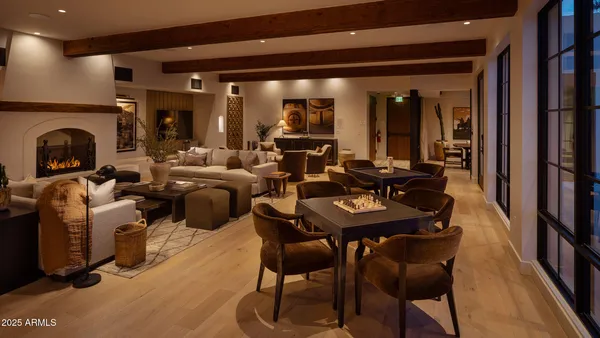 a living room with fireplace furniture and a fireplace
