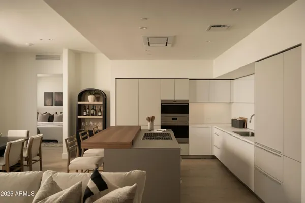 a bathroom with a sink and a refrigerator