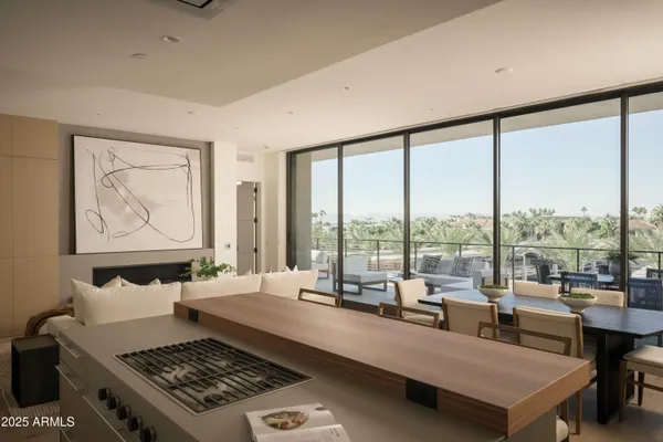 a kitchen with stainless steel appliances a refrigerator and a stove top oven
