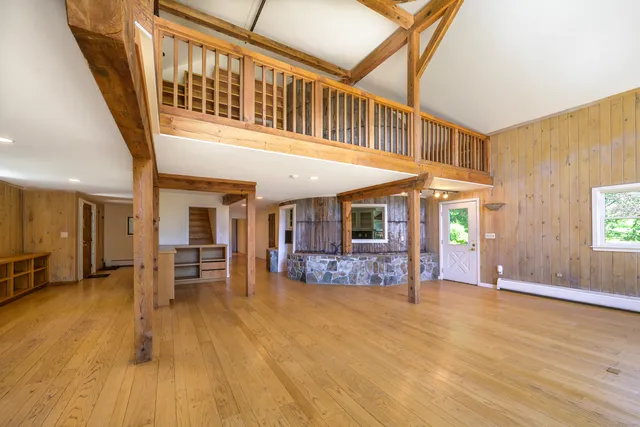 a view of a livingroom with furniture hardwood floor and staircase
