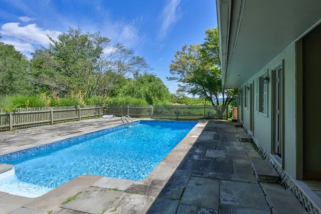 a view of a small yard with a tree