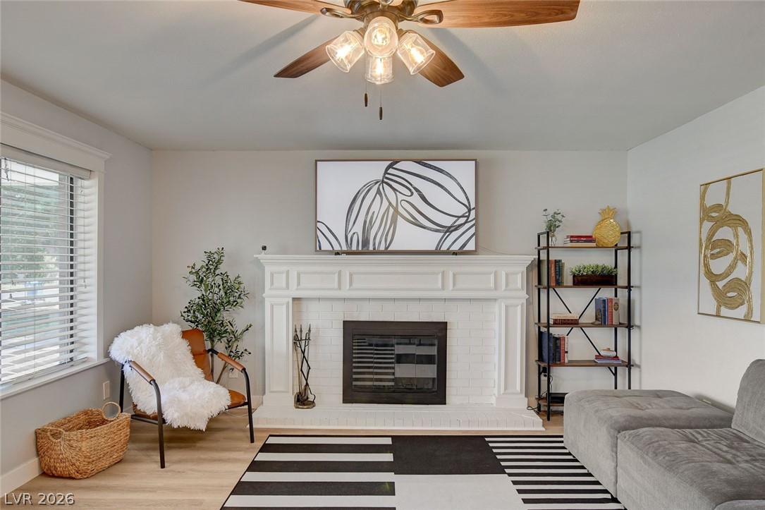 3765 Berkeley Street Logandale, NV 89021 - Photo 17 of 87 Bright and airy living area with a classic fireplace and comfortable ambiance.