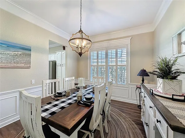 a view of a porch with furniture and floor to ceiling window