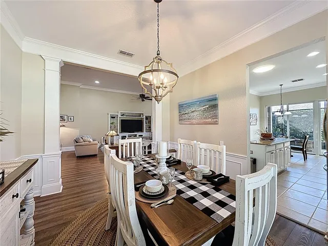 a living room with furniture a rug and a table