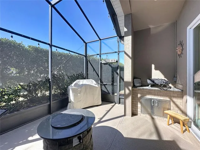 a spacious bathroom with a granite countertop sink a toilet a mirror a vanity and shower