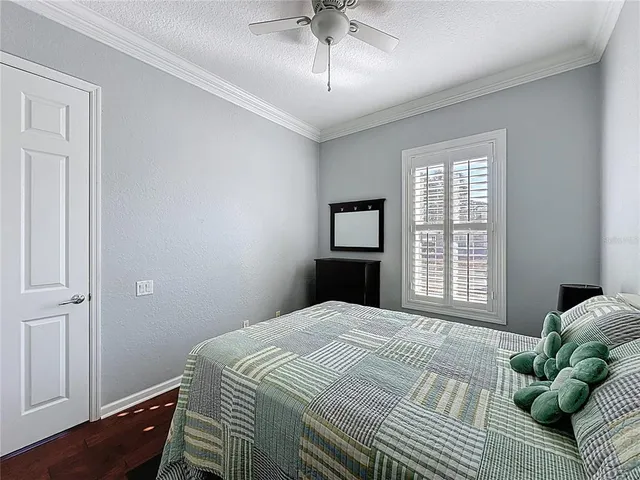 an aerial view of a house with a yard swimming pool and outdoor seating