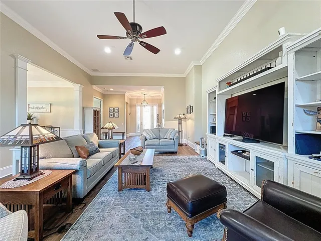 a living room with furniture or couch and a flat screen tv