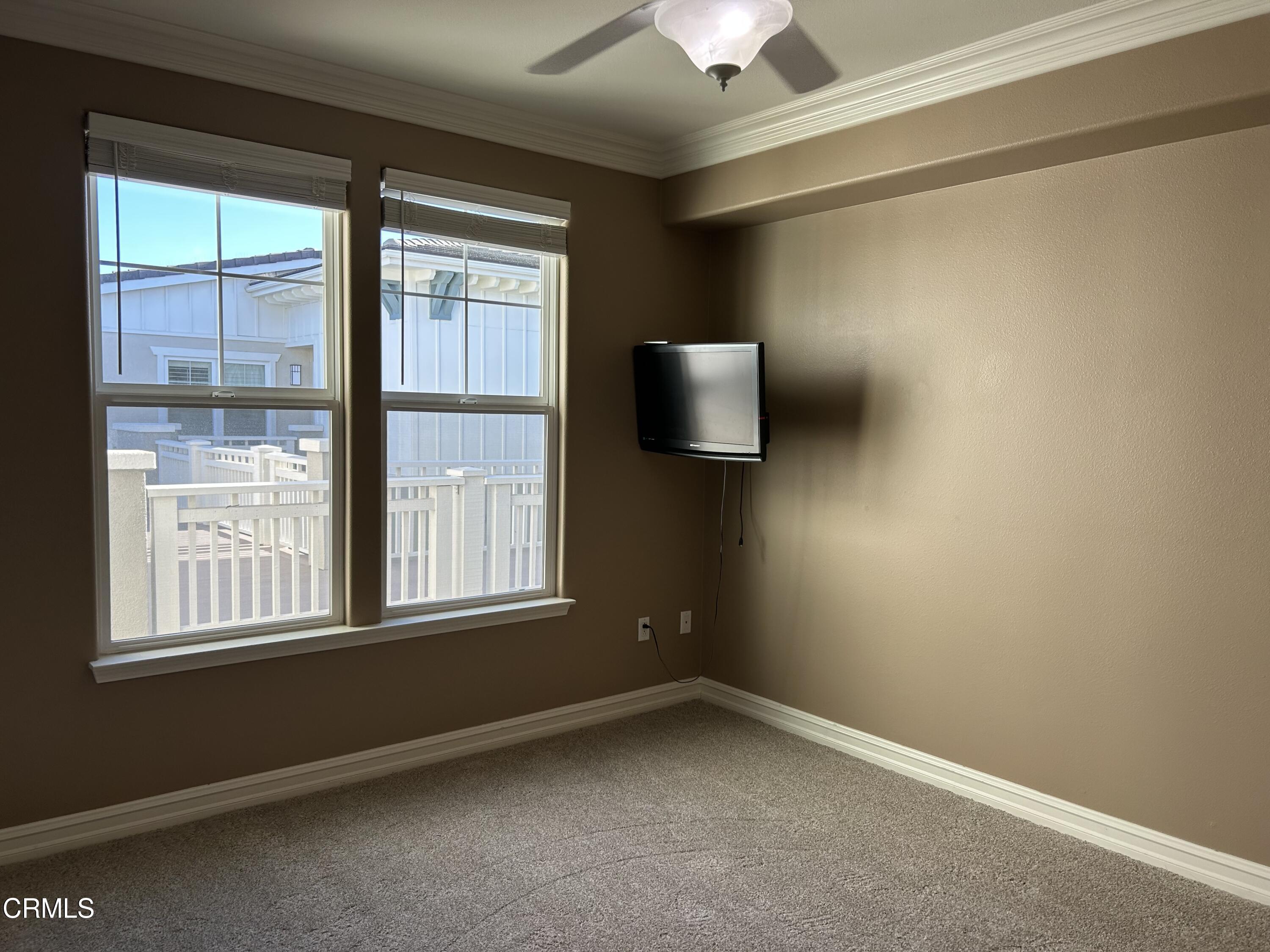 1561 Windshore Way Oxnard, CA 93035 - Photo 11 of 17 a view of an empty room with a window and hardwood floor