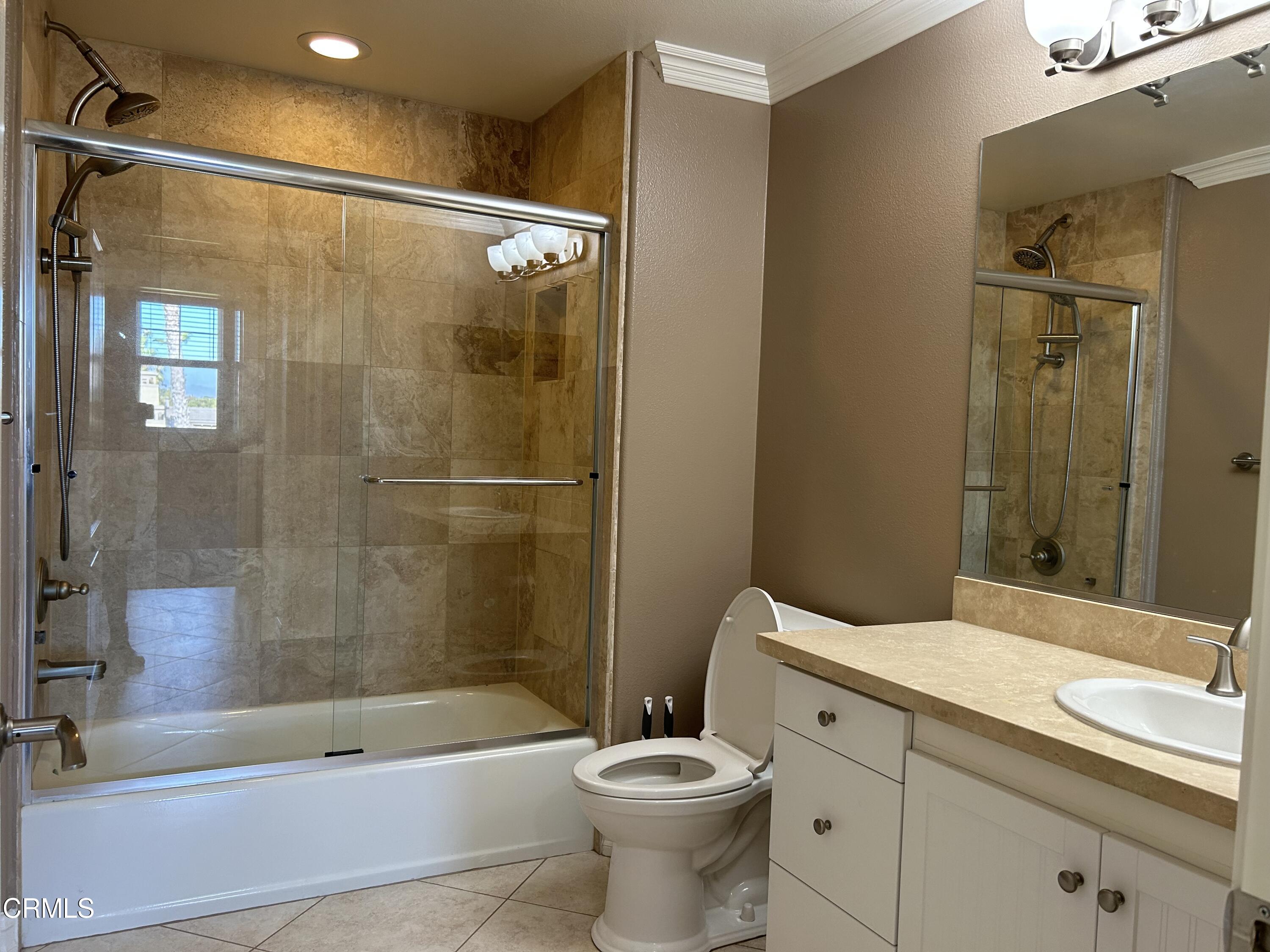1561 Windshore Way Oxnard, CA 93035 - Photo 15 of 17 a bathroom with a sink a toilet and shower
