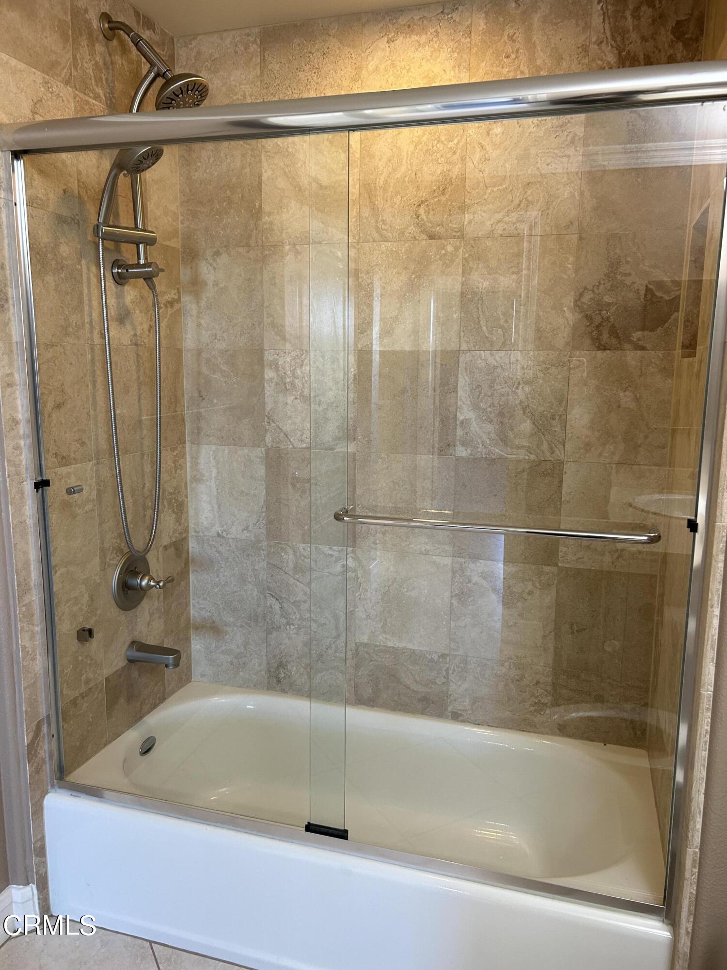 1561 Windshore Way Oxnard, CA 93035 - Photo 16 of 17 a bathroom with a bathtub and a shower