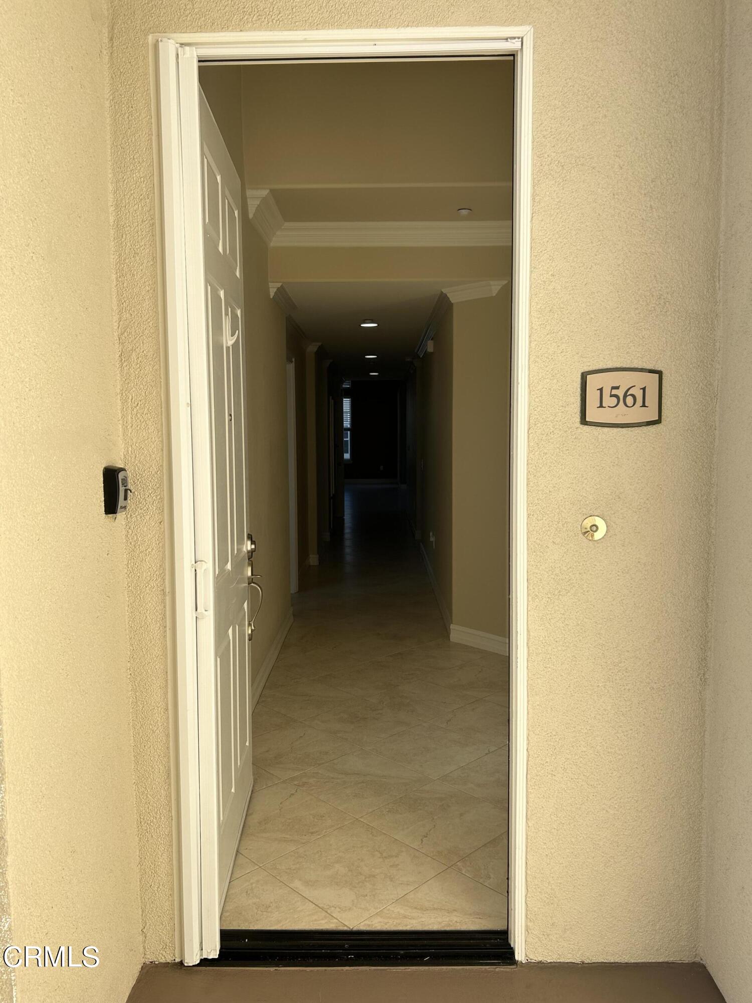 1561 Windshore Way Oxnard, CA 93035 - Photo 4 of 17 a view of a hallway with wooden floor