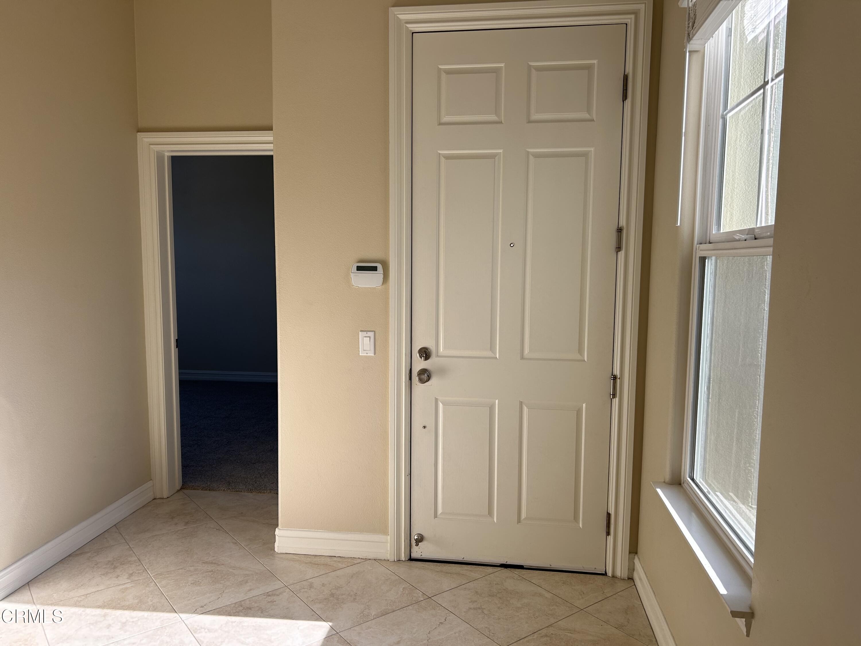 1561 Windshore Way Oxnard, CA 93035 - Photo 5 of 17 an empty room with windows