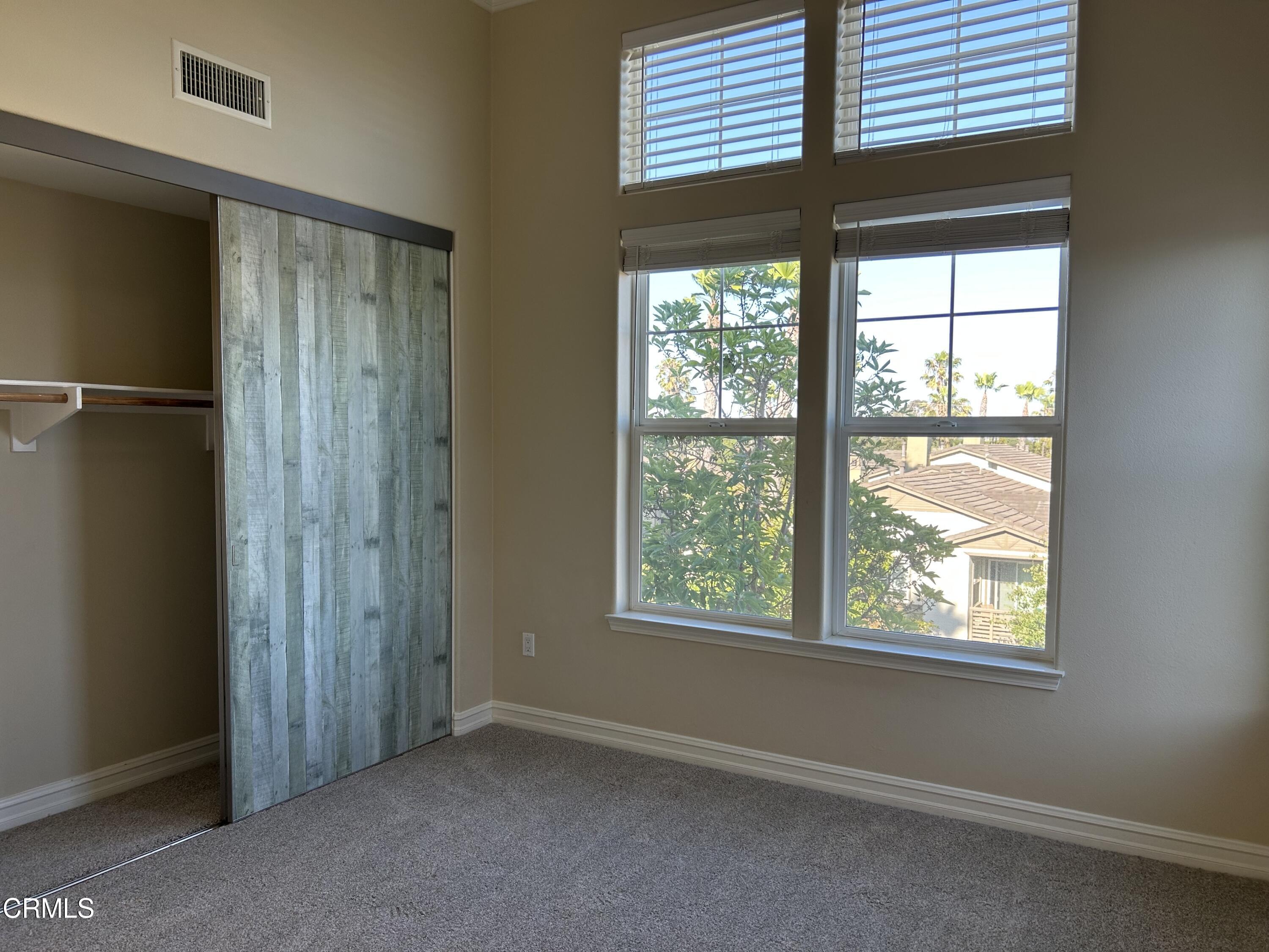 1561 Windshore Way Oxnard, CA 93035 - Photo 7 of 17 an empty room with windows