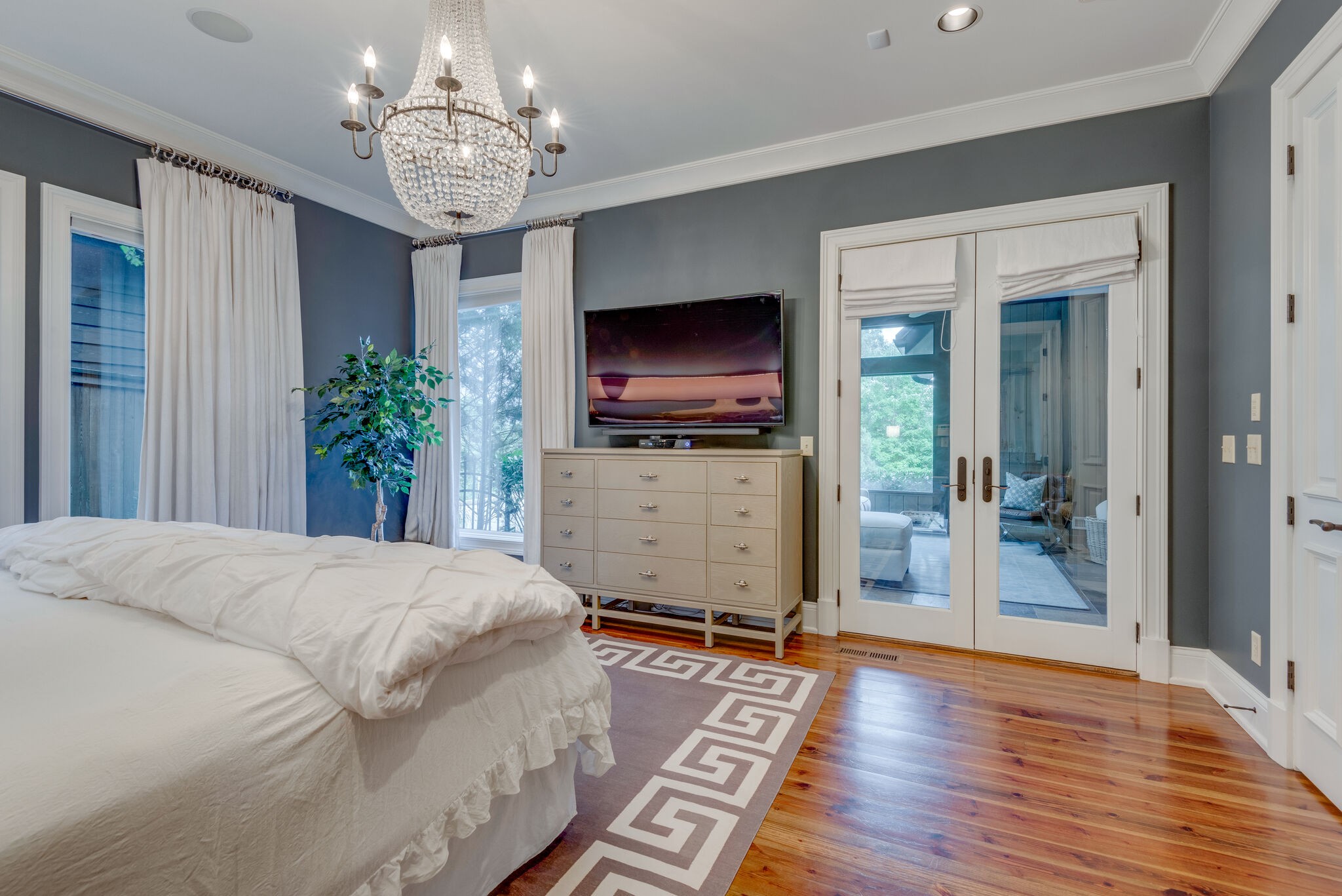 4315 Sneed Road Nashville, TN 37215 - Photo 20 of 50 a spacious bedroom with a bed and a flat screen tv