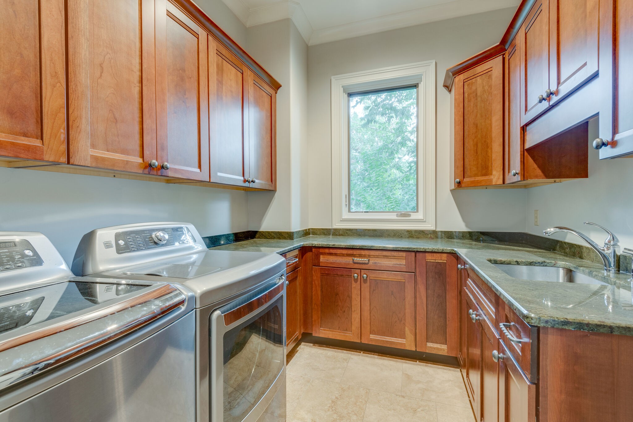 4315 Sneed Road Nashville, TN 37215 - Photo 26 of 50 a kitchen with stainless steel appliances granite countertop a sink a stove and cabinets